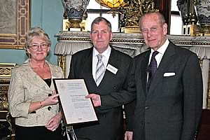 HRH Prince Philip presents the RABDF Prince Philip Award to Northern Dairy Supplies' Alex Barber and his wife, Evelyn