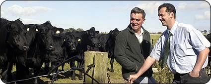Duff Burrell (left) with his Aberdeen Angus cattle