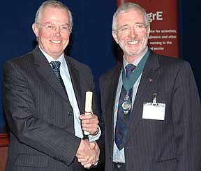 Peter Leech (left) receiving his Award of Merit certificate