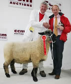 Roger Banks is pictured left with the reserve inter-breed male champion at Skipton and main sponsor Nick Gray.