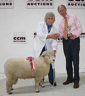 Margaret Hipps is pictured with her Skipton Ryeland Down inter-breed champion, receiving the trophy from main sponsor Nick Gray.