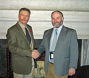 Out going Charolais International president, Garner Deobald of Canada congratulates his successor, Murray Lyle