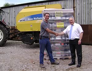 Martin Brooks (left) receiving his prize from UAT’s Tim Carr