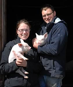 Michelle and Shaun Partington with Middle White piglets