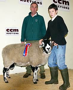 John Stockdale and his son Adam with their Skipton Swaledale ram champion.