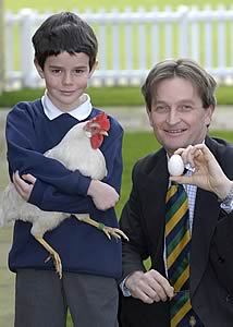 Chief Executive Nigel Pulling with Myles Kirk, aged 9, and Star the hen.