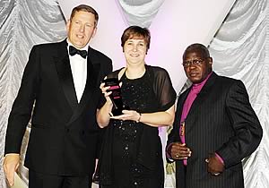 Cundall Lodge’s Caroline Barker is pictured at the awards ceremony with Peter Kay, left, from award sponsors Ware & Kay, and Dr John Sentamu, Archbishop of York.