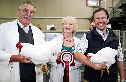 David Pownall is pictured left with his Craven Feather Auction White Wyandotte champions, joined by judges Daphne and Eric Hope.