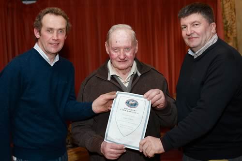 John Young, centre, was made Honorary President at the NI Blue Cattle Club AGM in recognition of his efforts on behalf of the breed. Club members James Martin, left, Ballyblack and Alan Cleland, Downpatrick, made the surprise presentation. Photograph: Columba O'Hare