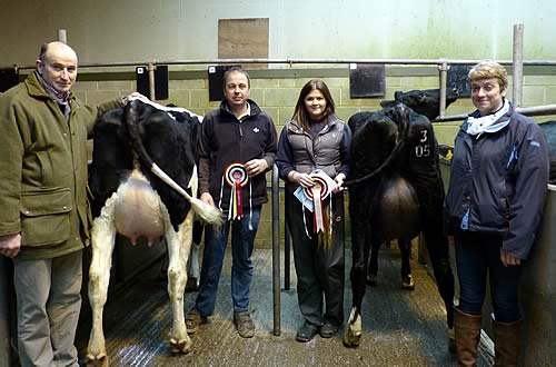 Judge Frank Wrathall, Andrew Jennings with his champion, Suzy Lawson with the reserve champion, and sponsor Helen Whittaker, of National Milk Records.