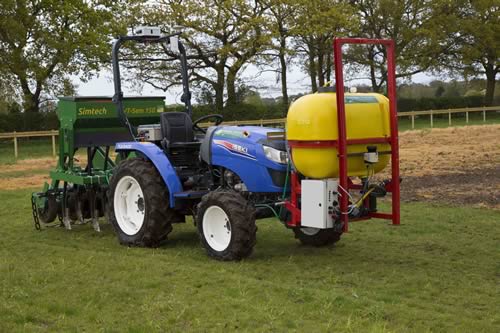 The tractor with drill and sprayer attached.