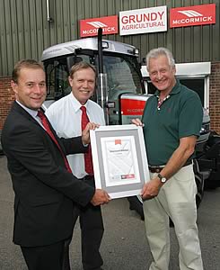 David Woolerton (right) receives his Diamond Edition tractor.