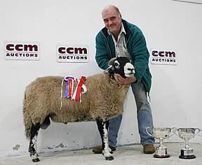 David Hargreaves with his Skipton Swaledale ram champion.