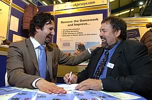 Nick Munce, Igenity (left) and Peter Prior, UK Jerseys sign the contract