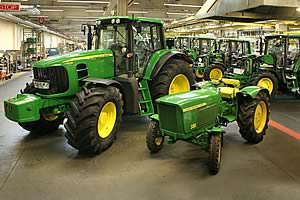 John Deere 7530 Premium and John Deere 300 tractors at the end of the John Deere Werke Mannheim (JDWM) assembly line.