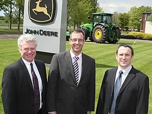 David Ward and Gary Davenport of VT Group with John Deere’s training manager Neil Macer.