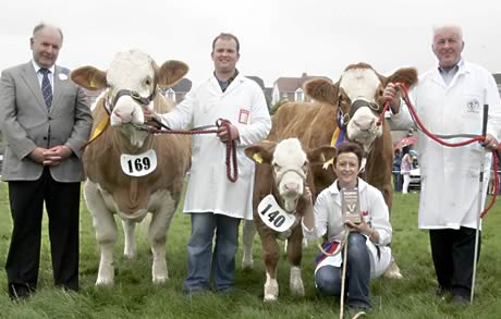 Judge, Brian Grant, Inverness, presents the Ivomec Super Simmental Pair of the Year Award to David Hazelton's Ranfurly herd, Dungannon. Included are Julie and Alan Wallace.