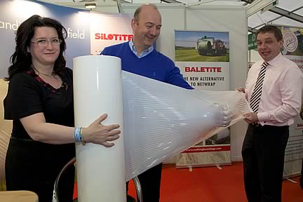 Shane Nolan, Finavara, North Clare (centre) of the Association of Farm Contractors in Ireland  with Louise Aplin, Celbridge  and Corkman Sean O'Connor of Silotite testing the strength of their Bale Wrap pictured at the Silotite Stand at the FTMTA Show 2013 at Punchestown, February 7th - 9th.