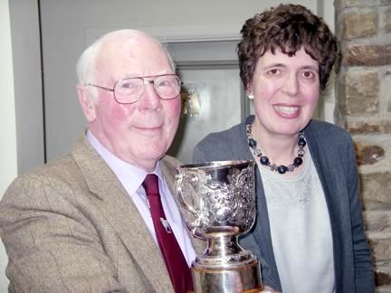 Mary Smith receives the Wensleydale Longwool Sheep Breeders’ Ruth Pedley Memorial Trophy from outgoing president Frank Pedley