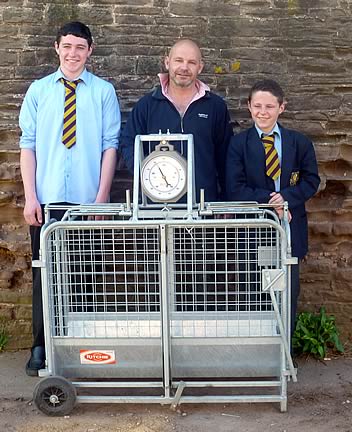 Ed Samuel (centre) with sons Rhys and Will and their new Ritchie weigh crate