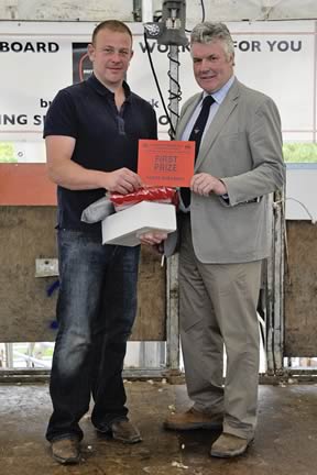 Adam Berry of Kendal Receiving his trophy from Malcolm Corbett Chair of the British Wool Marketing Board