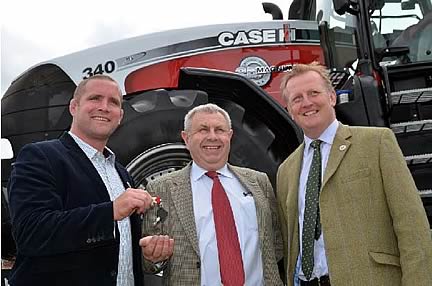 Bob Vaughan (centre) being presented with keys from Phil Vickery (left) with Cheffins auctioneer Bill King (right)