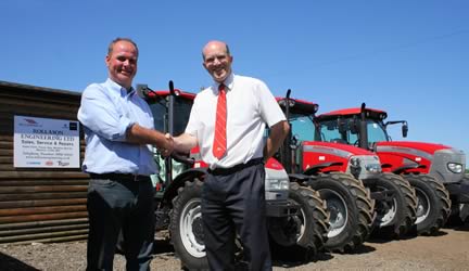 Tim Lawrence (right), AgriArgo UK area sales manager, welcomes Charlie Rollason to the McCormick tractor sales and service support network.