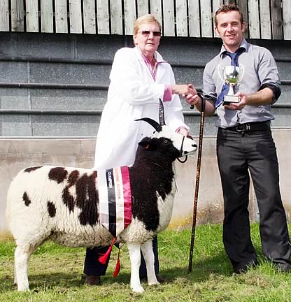 David Pownall is pictured left with his Craven Feather Auction White Wyandotte champions, joined by judges Daphne and Eric Hope.