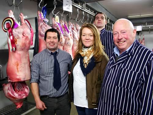 Oxenhope’s Stephen Pepper, left, checks out his 2012 Skipton Christmas prime lamb carcase champion, joined by wife Tracy, and judges Matthew Inskip and Ian Weatherhead.