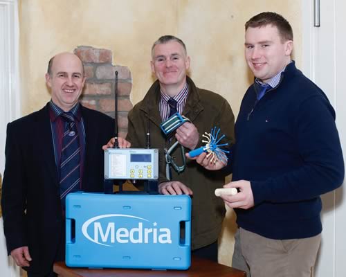 John Maher, right, PharVet, demonstrating the Vel’Phone Calving Detection System to Jason Edgar and Basil Dougherty
