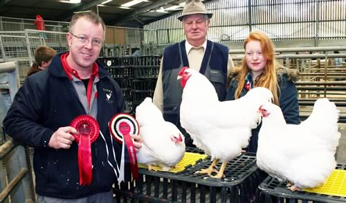 With the Craven Feather Auctions Spring champions are Richard Pickles, left, with daughter Selina and show judge Alan Parnaby
