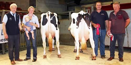 Pictured with the champion and reserve are, from left, sponsor Keith Colley, of BOCM Pauls, title winner Sammy Sugden and her eight-month-old son Henry Phillip, reserve champion Andrew Jennings and show judge David Berry.
