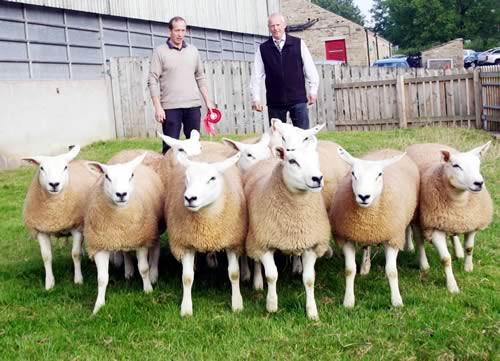 David Towell, left, with his first prize Skipton pen of Texel gimmer lambs, joined by judge Robert Towers.