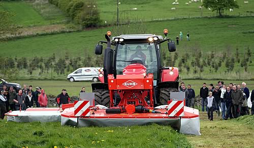 visitors to the previous Grassland North event at Newton Rigg College watching demonstrations with a Massey Ferguson 7620 with two Kuhn FC313 mowers.