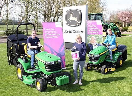 (Left to right) Andy, Karen and Kathryn Maxfield try out John Deere’s lawn tractors for size at the company’s UK & Ireland headquarters in Langar, Nottingham.